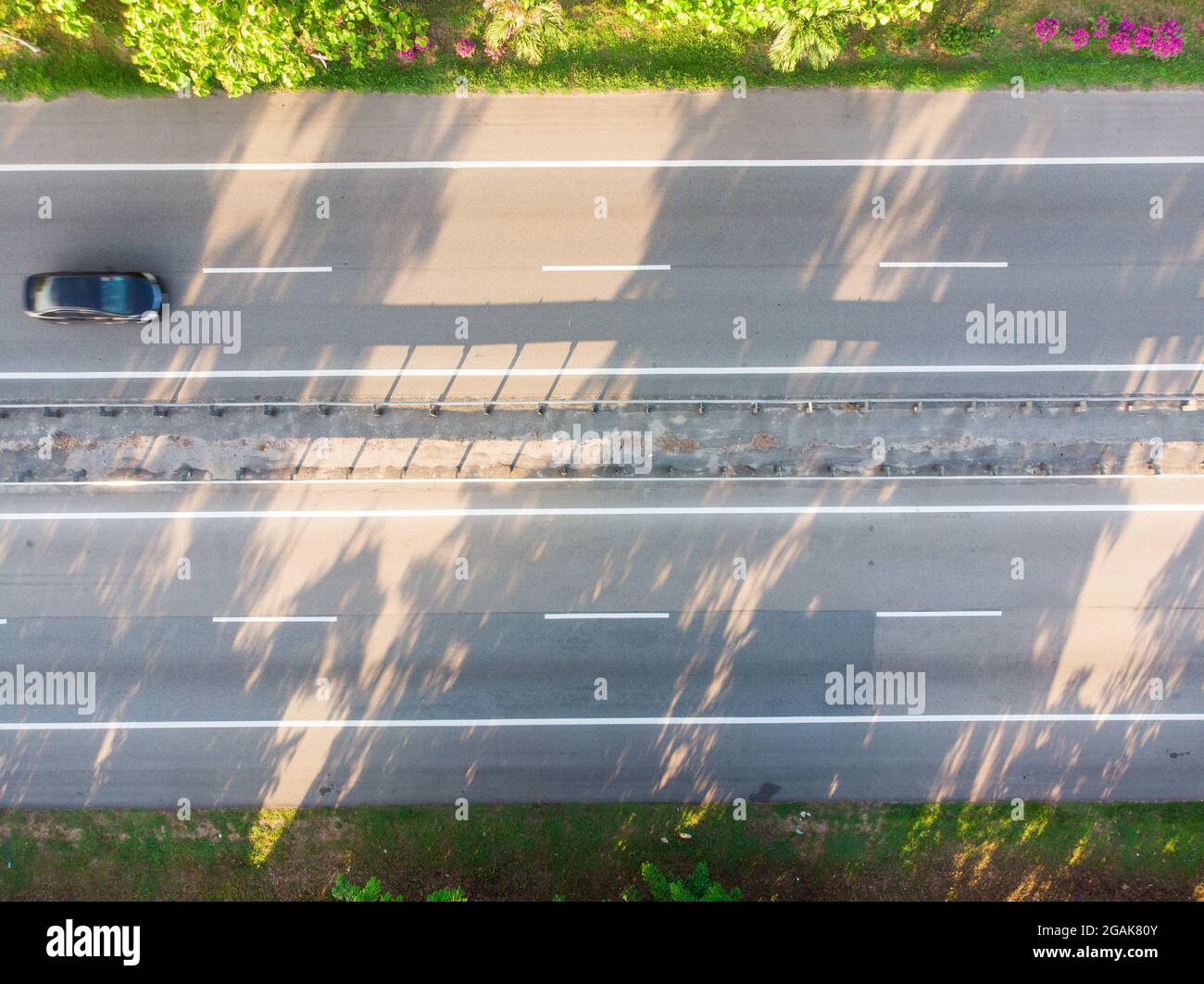 Aerial view of a car moving on a countryside highway Stock Photo