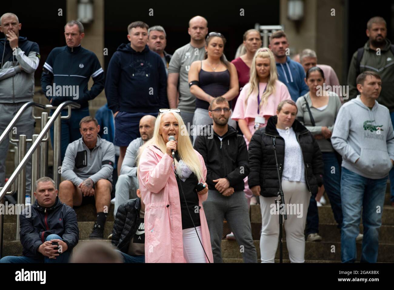 Glasgow, Scotland, UK. 30 July 2021.  PICTURED:  People speaking about their experiences of steps of Buchanan Street. Drug deaths in Scotland have increased to a new record peak for the seventh year in a row, according to “horrifying and heartbreaking” figures published today.  The “shocking” news that 1,339 people died from drugs in 2020 means that Scotland’s drug death rate remains by far the worst in Europe.  Credit: Colin Fisher Stock Photo