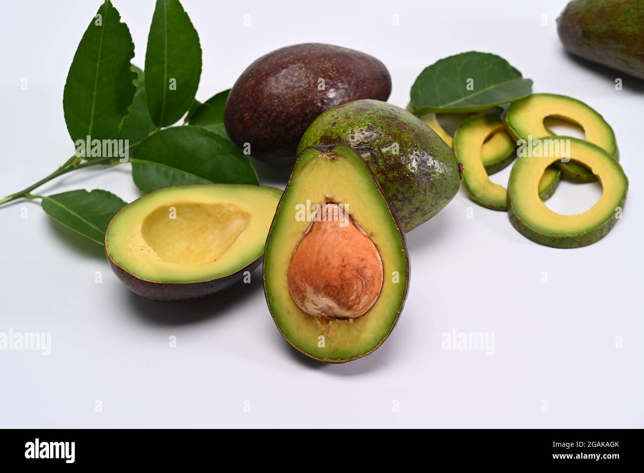 Whole and sliced avocado isolated on white background Stock Photo - Alamy