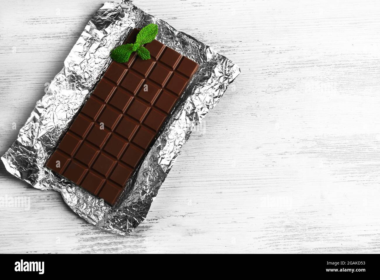Dark Chocolate bar in foil on gray background Stock Photo Alamy