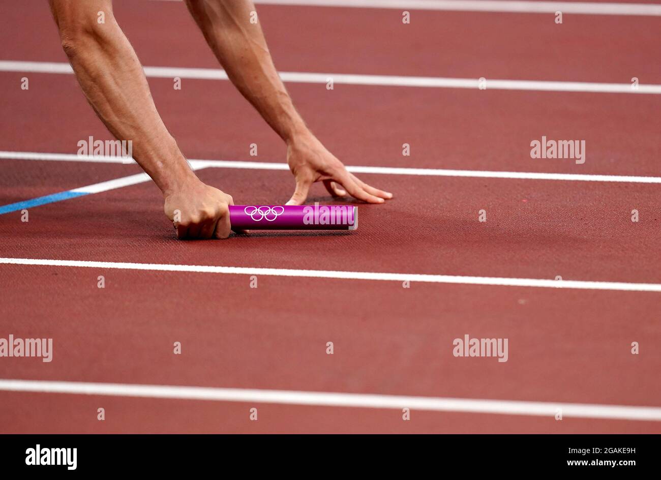 A general view of an athlete holding a relay baton prior to the ...