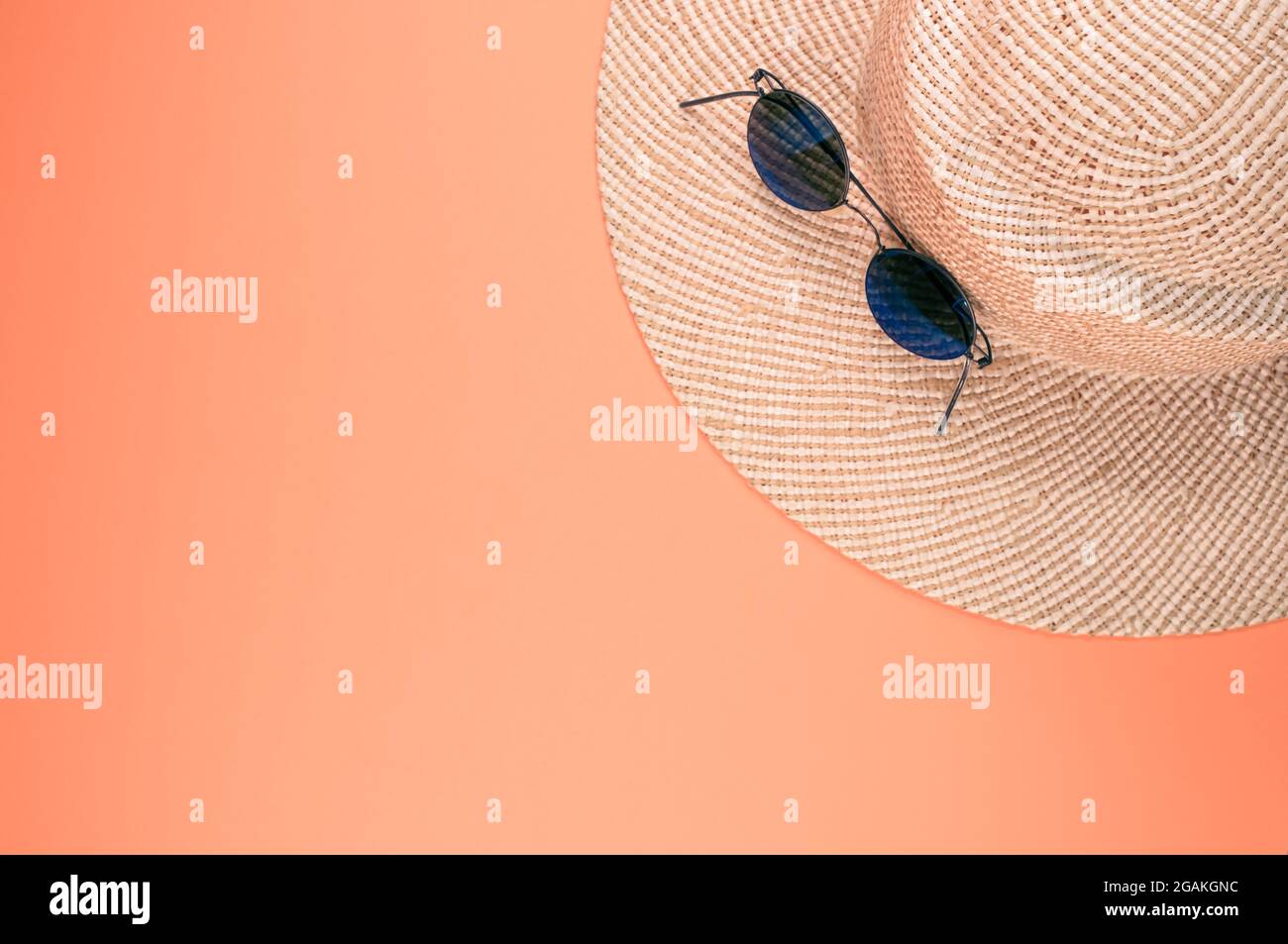 Top view of a straw hat and sunglasses on an orange surface Stock Photo ...