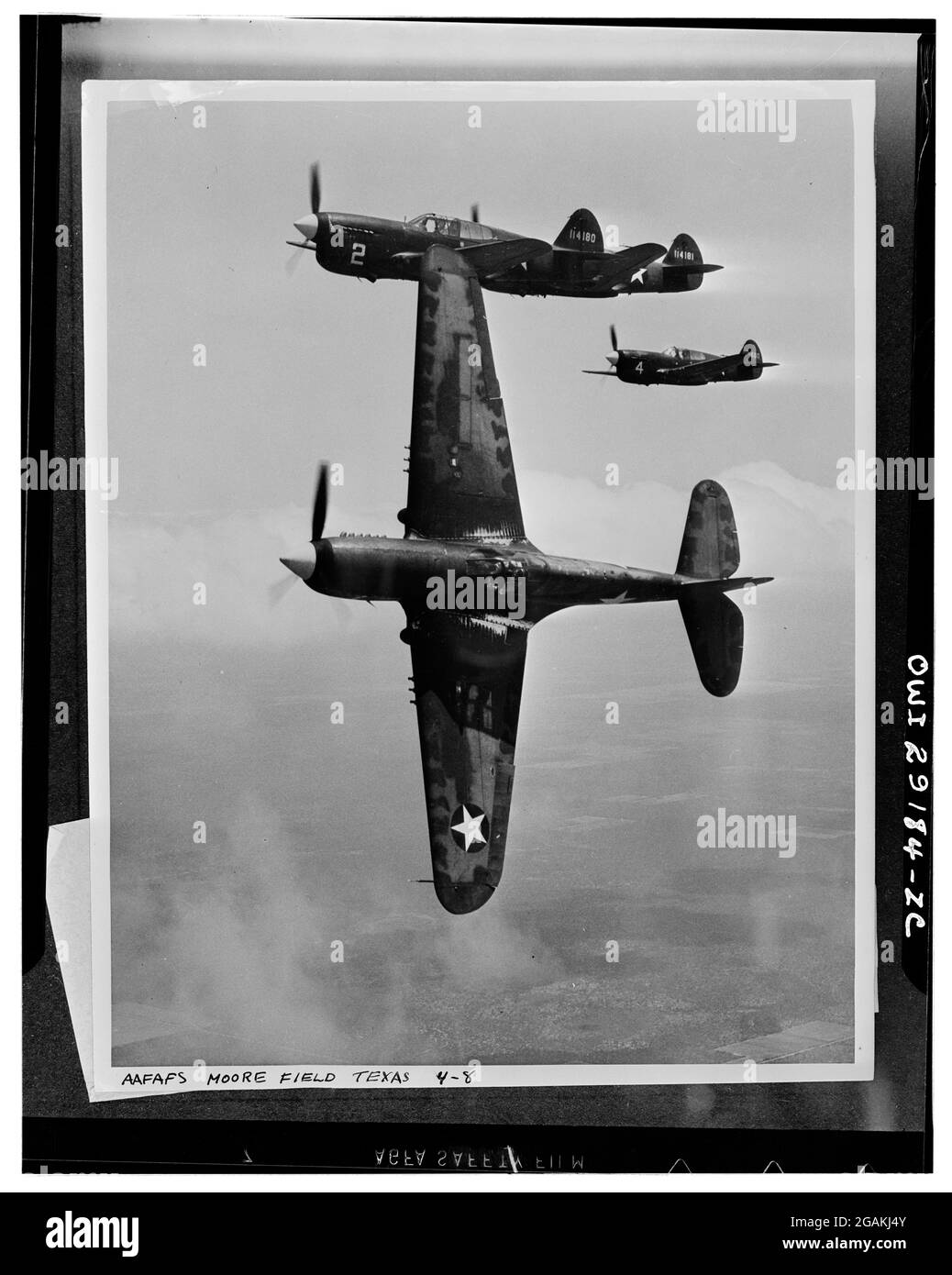 The lead ship in a formation of P-40's peeling off for the 'attack' in a practice flight at the Army Air Forces advanced flying school at Moore Field. Selected aviation cadets are given transition training in these fighter planes before receiving their pilot's wings, Mission, TX, 1943. (Photo by US Army Air Force/RBM Vintage Images) Stock Photo