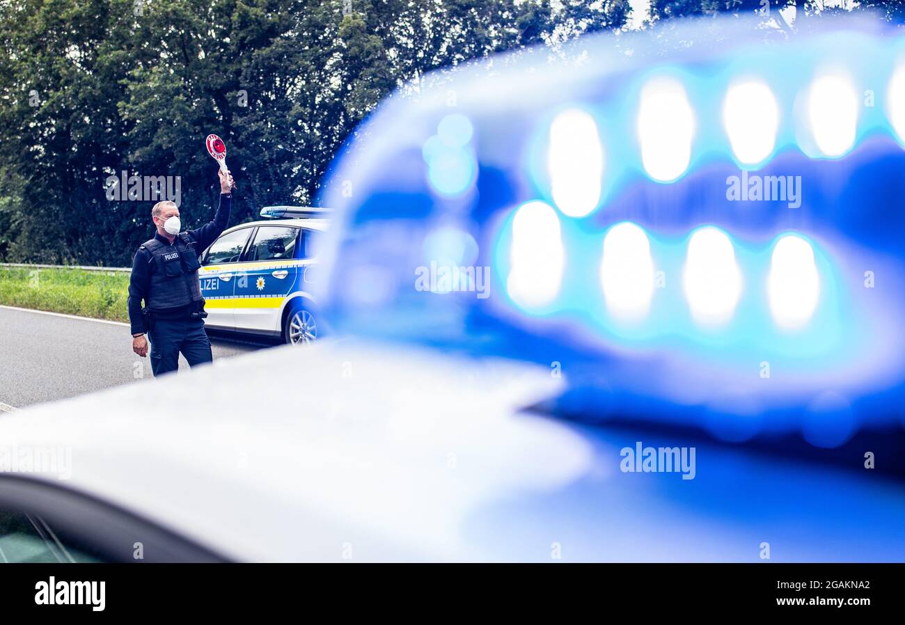 Emmerich, Germany. 31st July, 2021. A police officer stands with a ...
