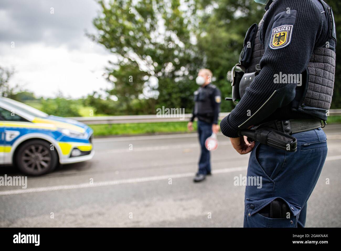 Emmerich, Germany. 31st July, 2021. Police officers stand during a ...