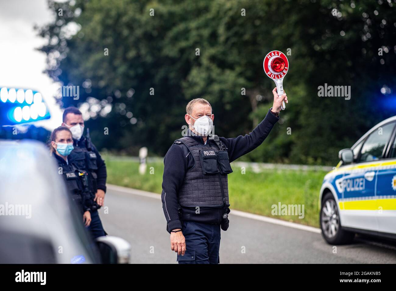 Emmerich, Germany. 31st July, 2021. A police officer stands with a ...