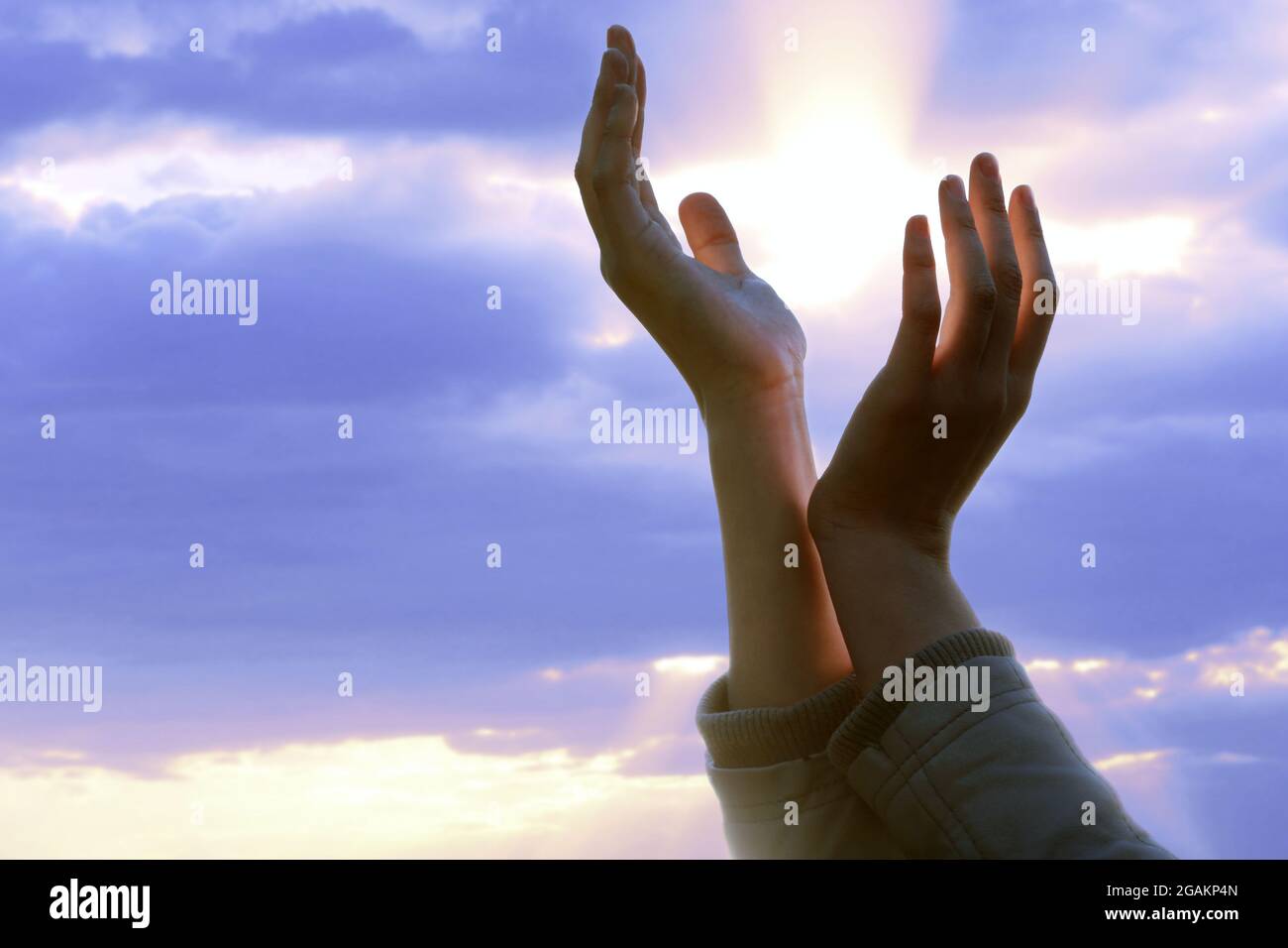Female hands on sunny sky background Stock Photo - Alamy