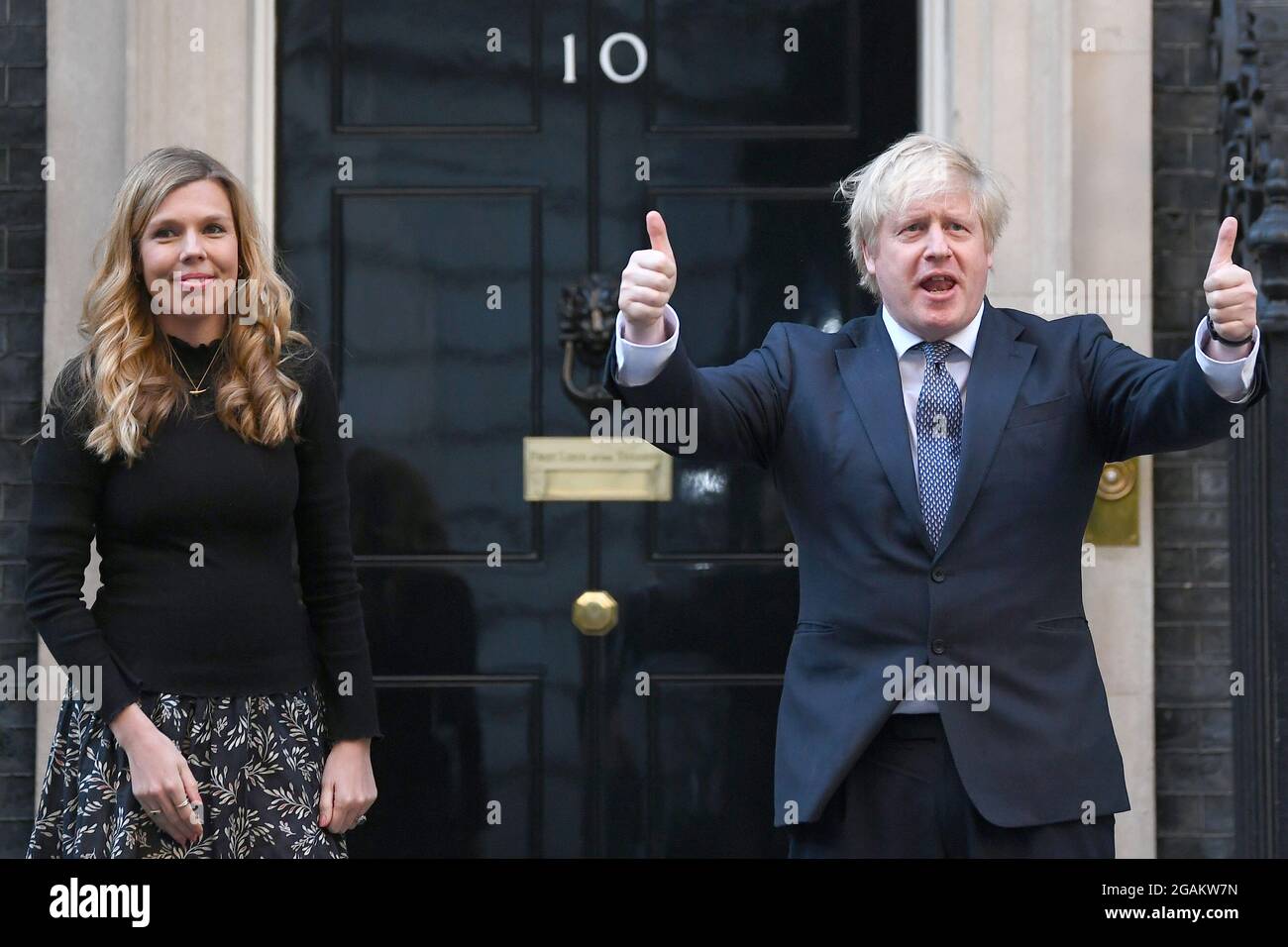 File photo dated 14/5/2020 of Prime Minister Boris Johnson and his partner Carrie stand in Downing Street, London. The Prime Minister and his wife are expecting a second child after she revealed the heartbreak of a miscarriage at the start of the year. In a statement on social media, Ms Johnson said the brother or sister to their first child Wilfred was due to arrive 'this Christmas'. Issue date: Saturday July 31, 2021. Stock Photo