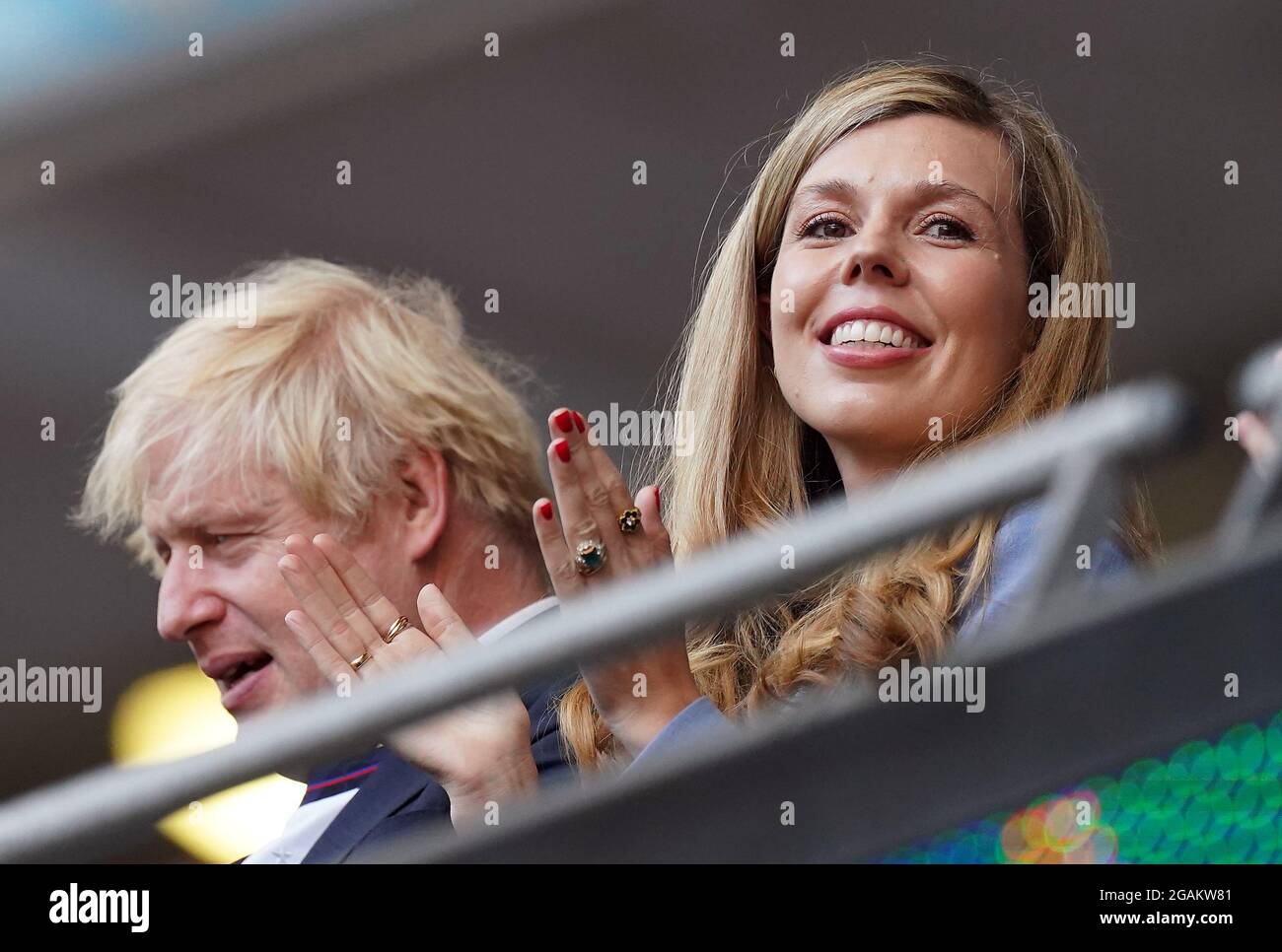 File photo dated 7/7/2021 of Prime minister Boris Johnson and Carrie Johnson in the stands during the UEFA Euro 2020 semi final match at Wembley Stadium, London. The Prime Minister and his wife are expecting a second child after she revealed the heartbreak of a miscarriage at the start of the year. In a statement on social media, Ms Johnson said the brother or sister to their first child Wilfred was due to arrive 'this Christmas'. Issue date: Saturday July 31, 2021. Stock Photo