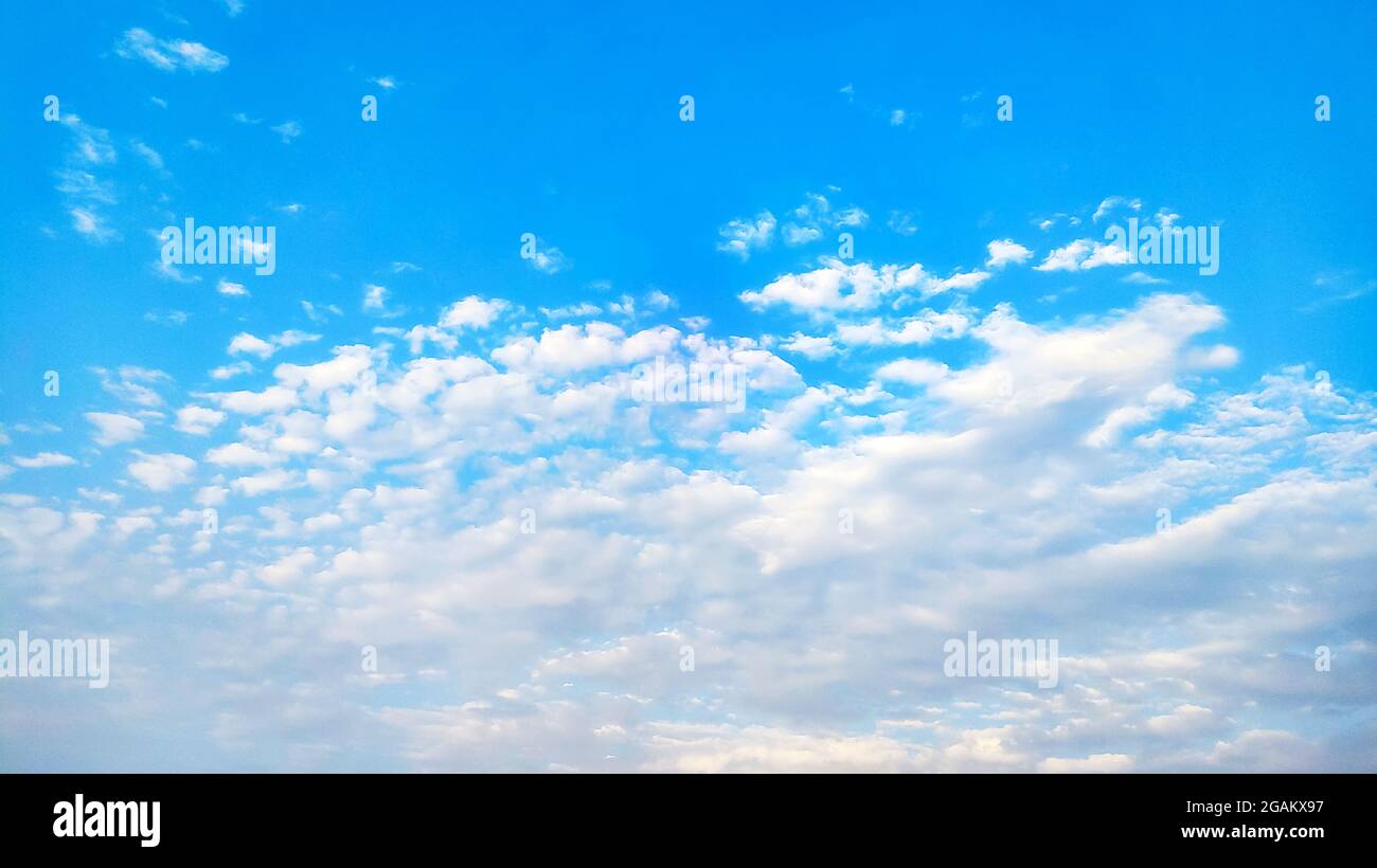 blue sky background with tiny clouds Stock Photo Alamy
