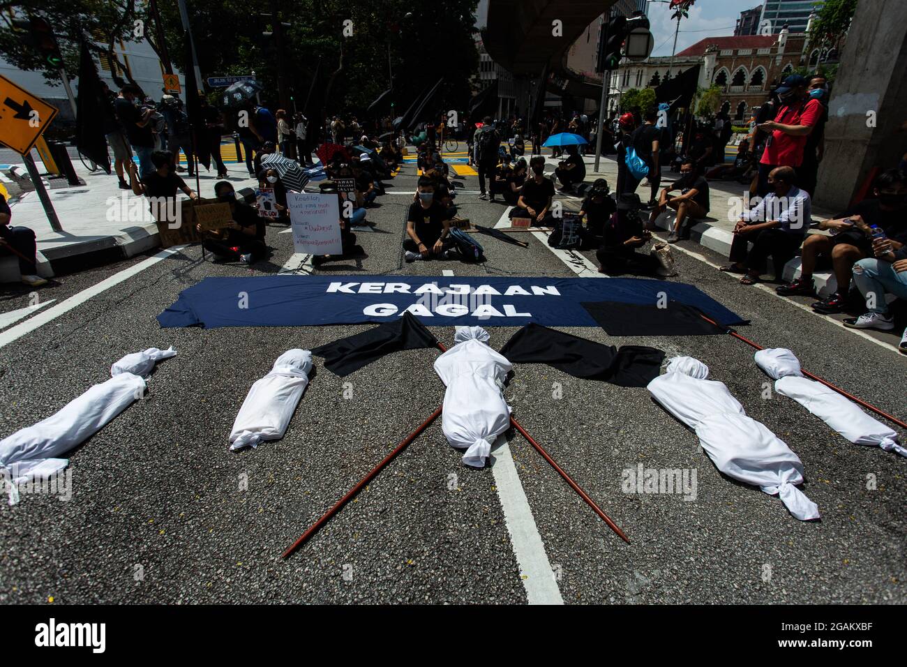 Kuala Lumpur Malaysia 31st July 2021 Protestors Brought Mock Corpses Wrapped In Kapan Cloth To Symbolize The High Number Of Daily Deaths From Covid 19 In Malaysia As Well As The Country S Collapsing