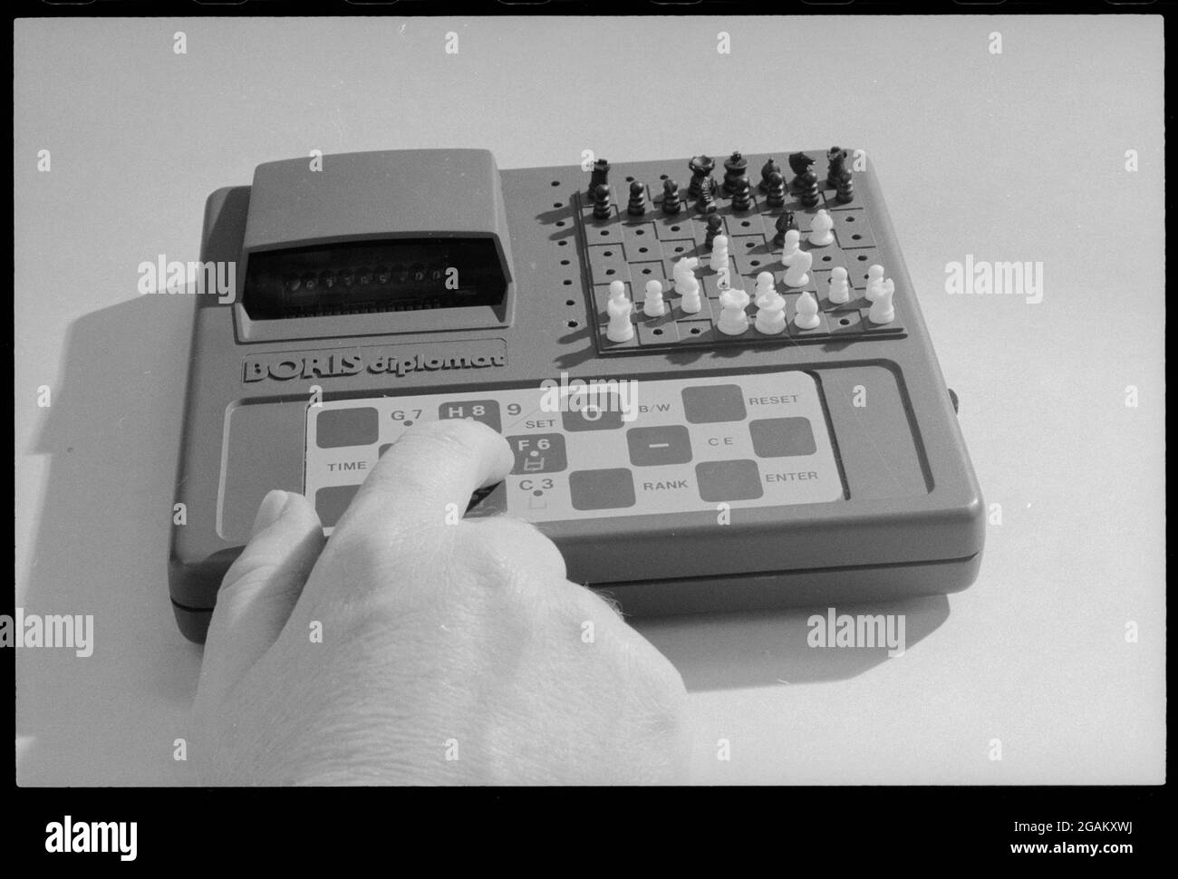 Closeup of hand on a 'Boris Diplomat' electronic travel computer chess game designed and manufactured by Applied Concepts, no location, 2/14/1979. (Photo by Marion S Trikosko/US News & World Report Collection/RBM Vintage Images) Stock Photo