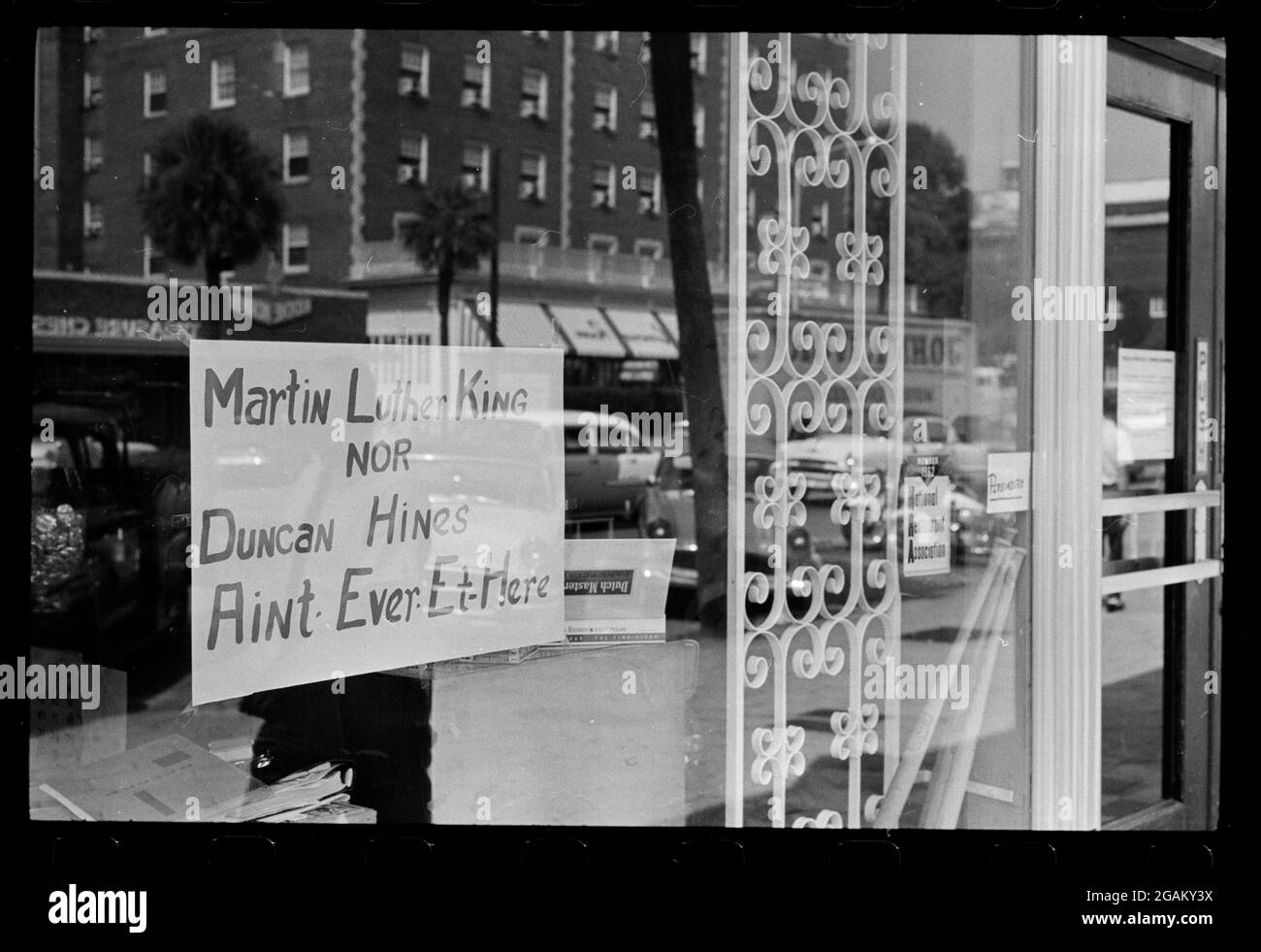 Sign posted on window of a restaurant reading 'Martin Luther King Nor Duncan Hines Ain't Ever Et Here' warns that the business refuses service to African-Americans, Albany, GA,8/18/1962. (Photo by Warren K Leffler/US News & World Report Collection/RBM Vintage Images) Stock Photo