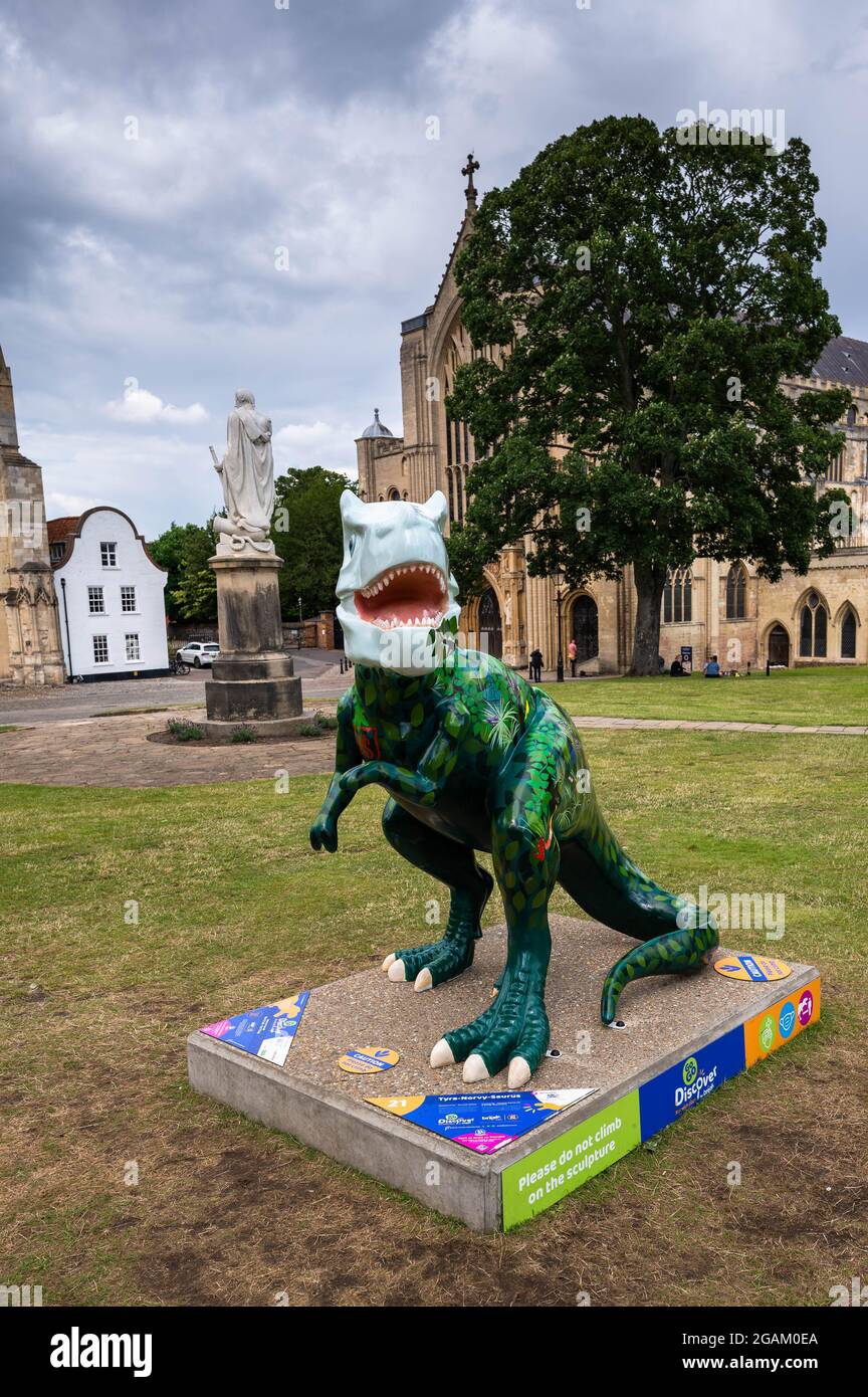 GoGo Tyra-norvy-saurus dinosaur number 21 in Norwich cathedral grounds raising awareness for childrens charity Stock Photo