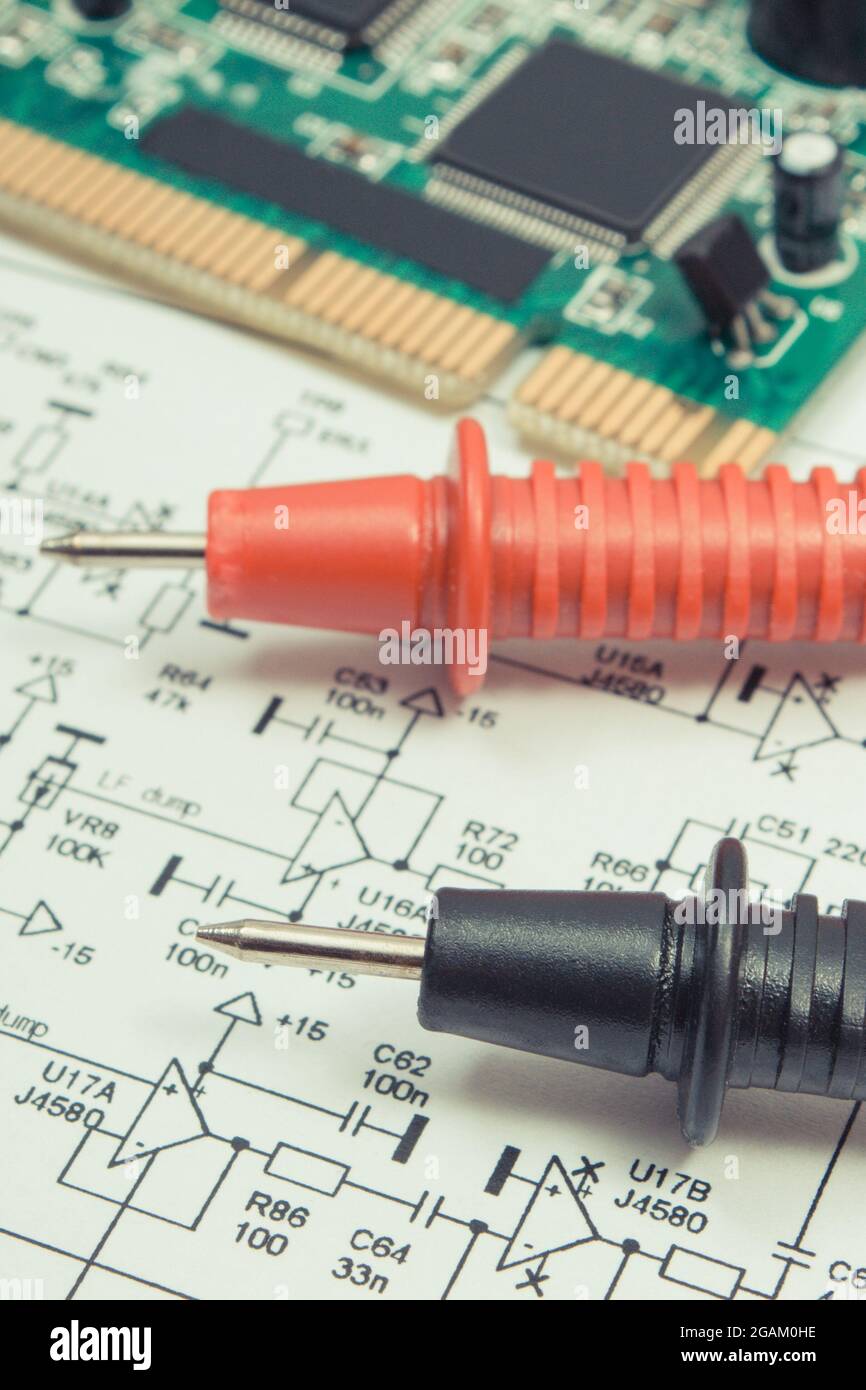 Printed circuit board with transistors, resistors, capacitor. Diagram of electronics and cable