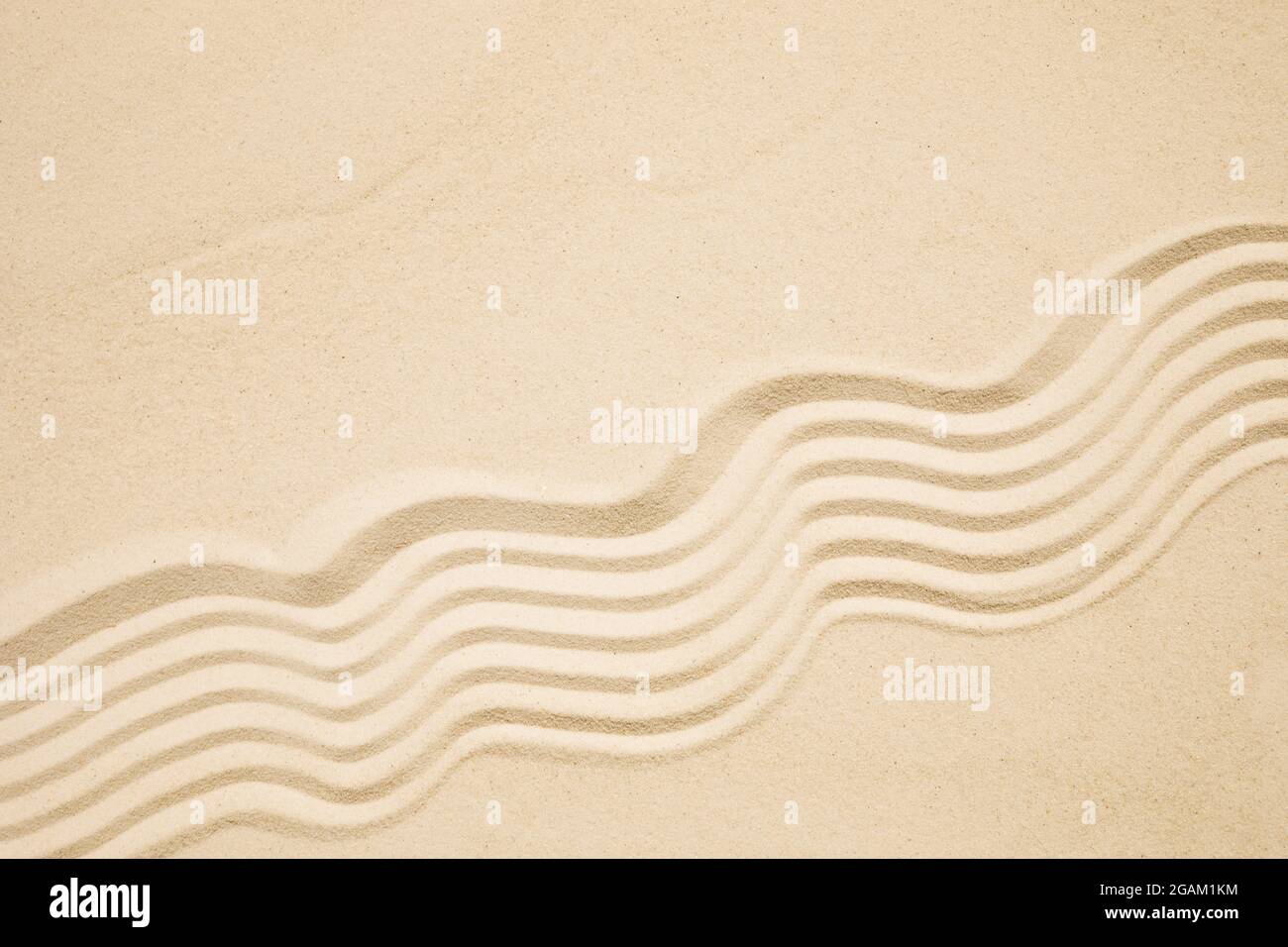 Sea sand with waves background. Top view. Flat lay Stock Photo