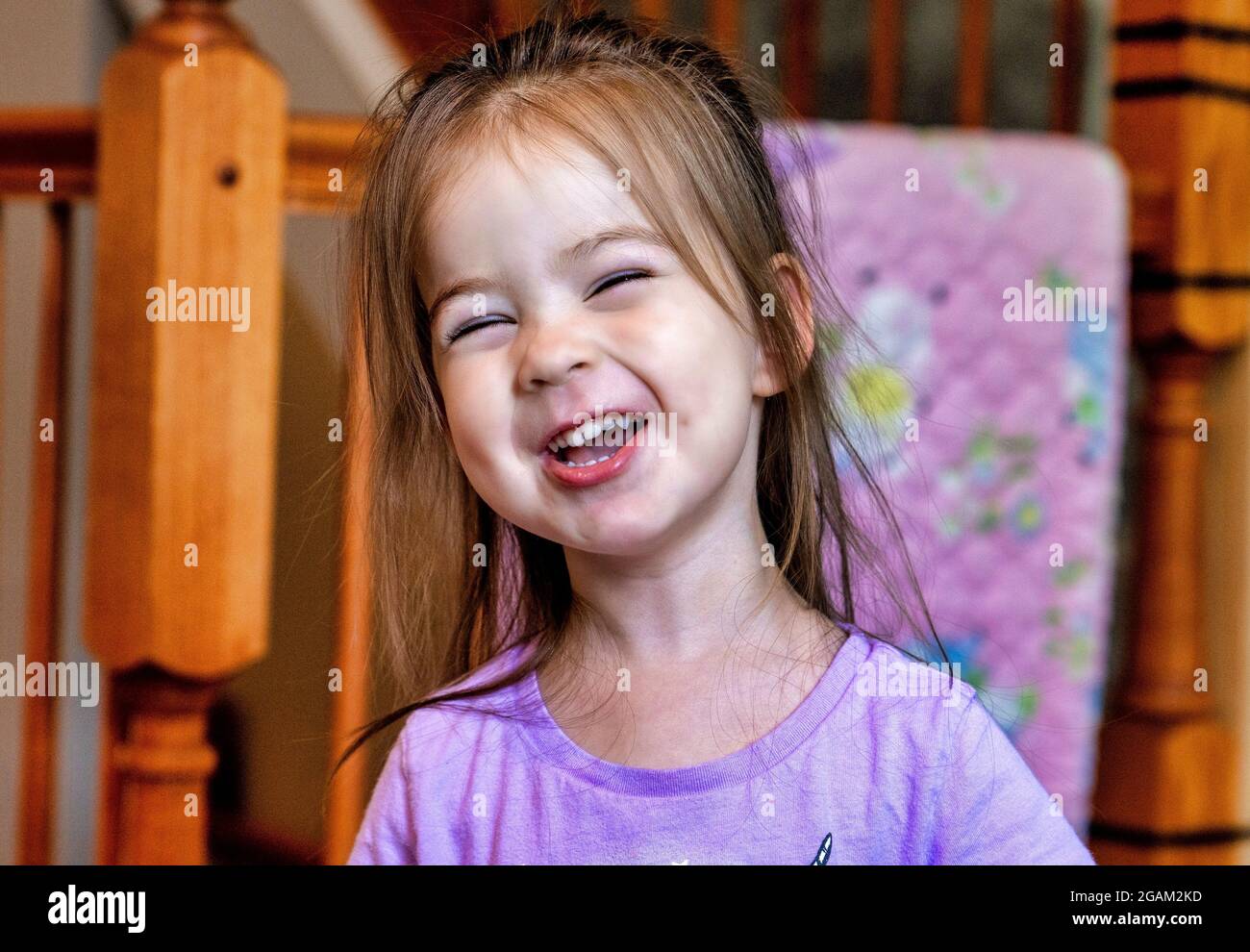 A cute twoyear old puts on her funny face Stock Photo Alamy