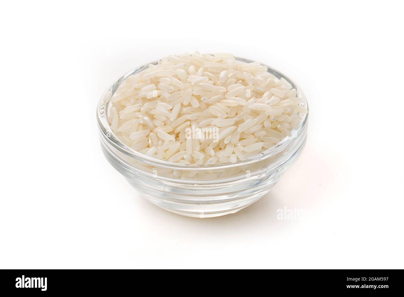 Raw white rice in a clear glass plate on a white background Stock Photo ...