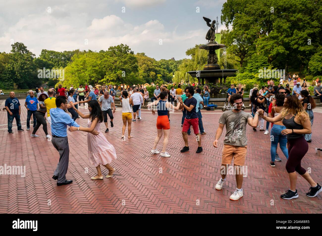Visitors to Central Park in Bethesda Plaza in New York participate in tango dancing on Sunday, July 25, 2021. (© Richard B. Levine) Stock Photo