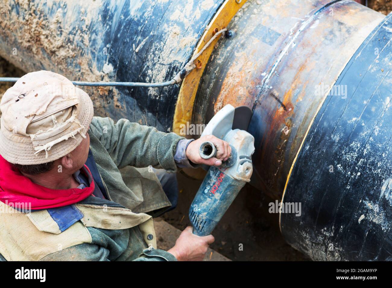 Odessa, Ukraine October 11, 2016 Repair of heating duct. The workers