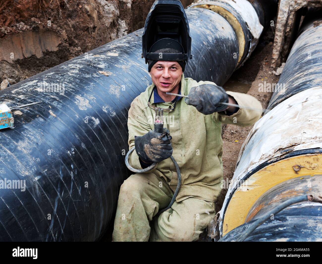 Odessa, Ukraine October 11, 2016 Repair of heating duct. The workers