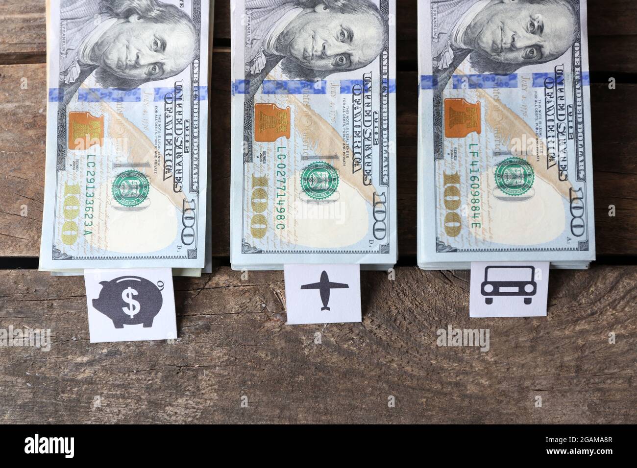 Packs of American dollars, on wooden background. Saving concept Stock Photo Alamy