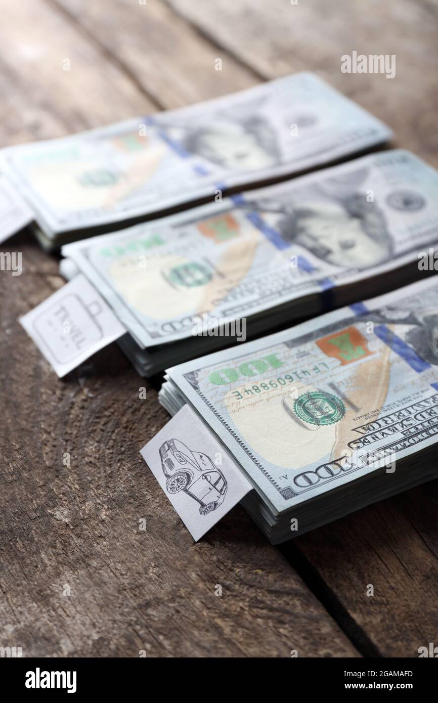 Packs of American dollars, on wooden background. Saving concept Stock Photo Alamy