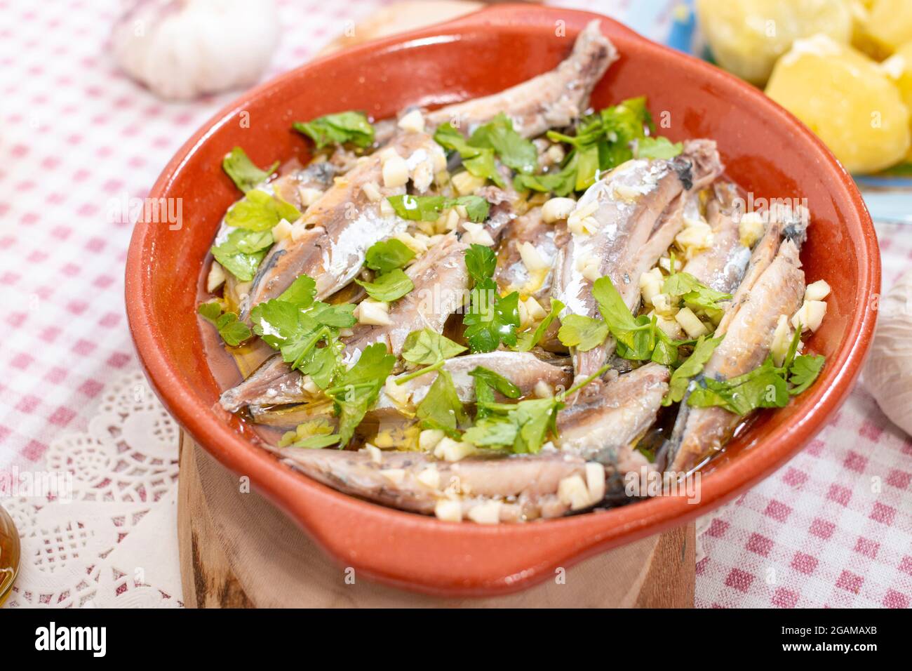 Traditional Portuguese Atlantic horse mackerel meal with garlic, olive