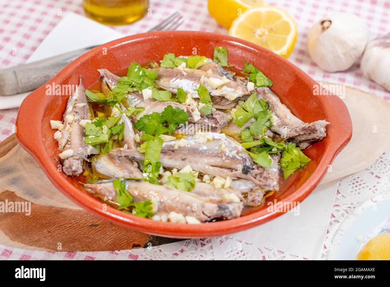 Traditional Portuguese Atlantic horse mackerel meal with garlic, olive