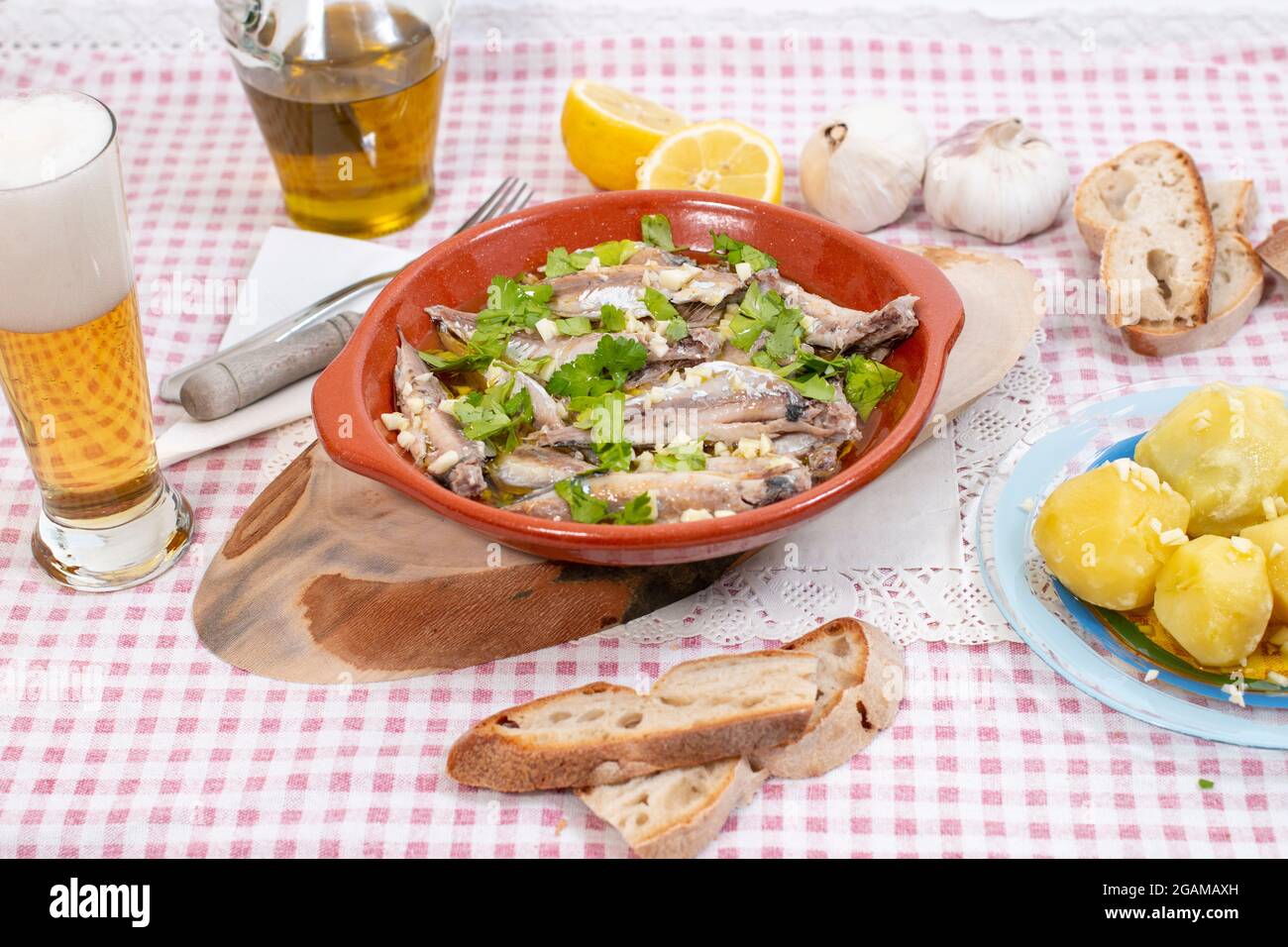 Traditional Portuguese Atlantic horse mackerel meal with garlic, olive