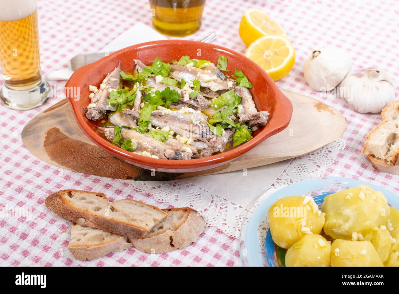 Traditional Portuguese Atlantic horse mackerel meal with garlic, olive