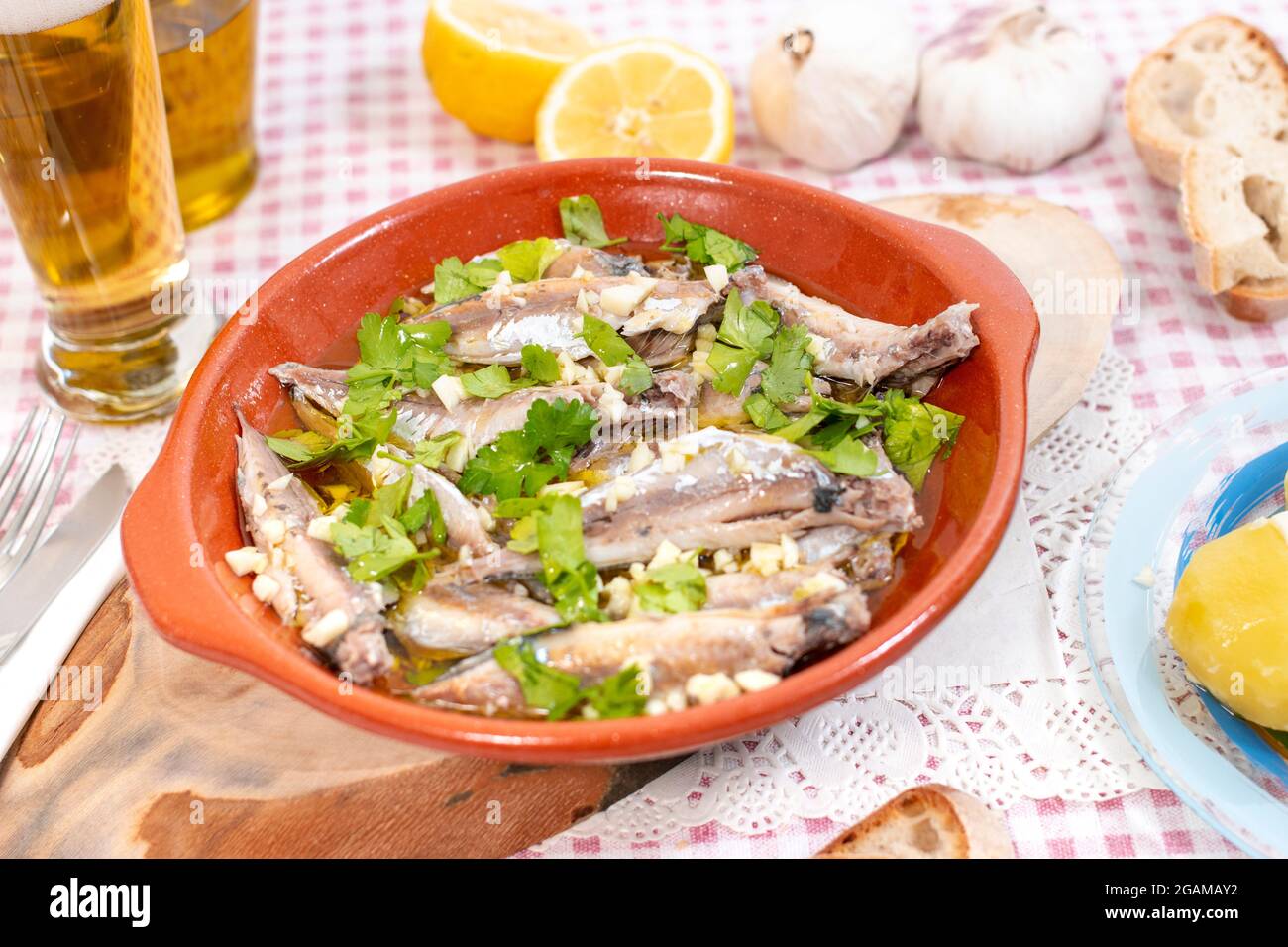 Traditional Portuguese Atlantic horse mackerel meal with garlic, olive