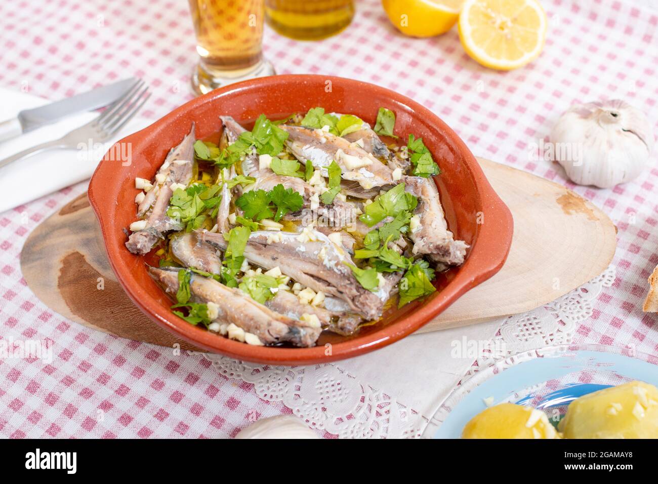 Traditional Portuguese Atlantic horse mackerel meal with garlic, olive