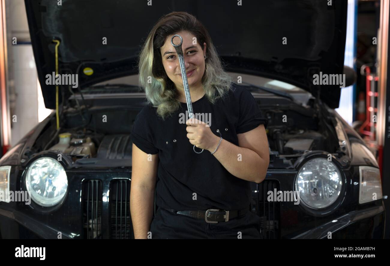 Car mechanic girl working in her car repair shop Stock Photo Alamy