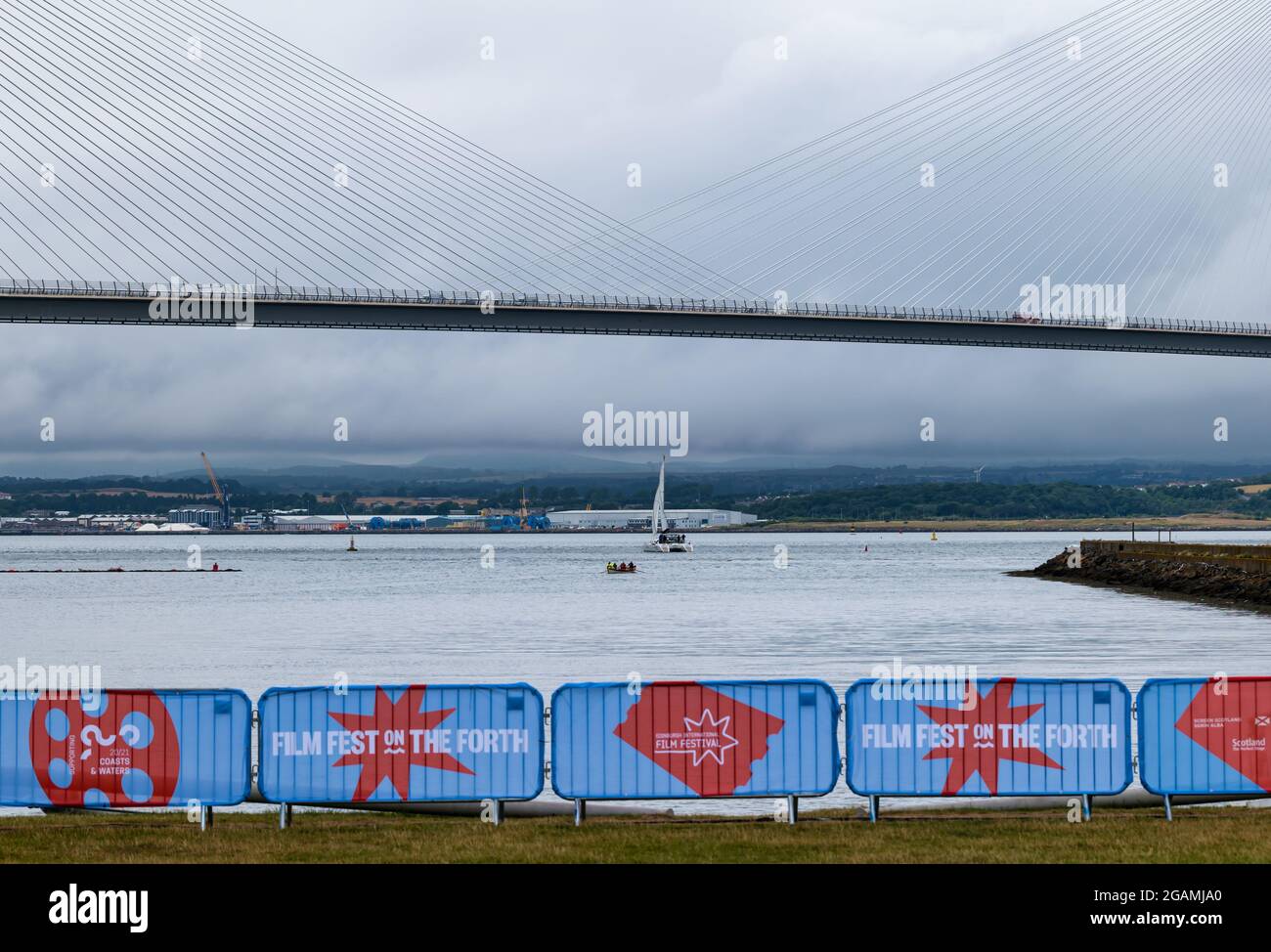 Catamaran and coastal rowing boat sailing at Edinburgh International ...