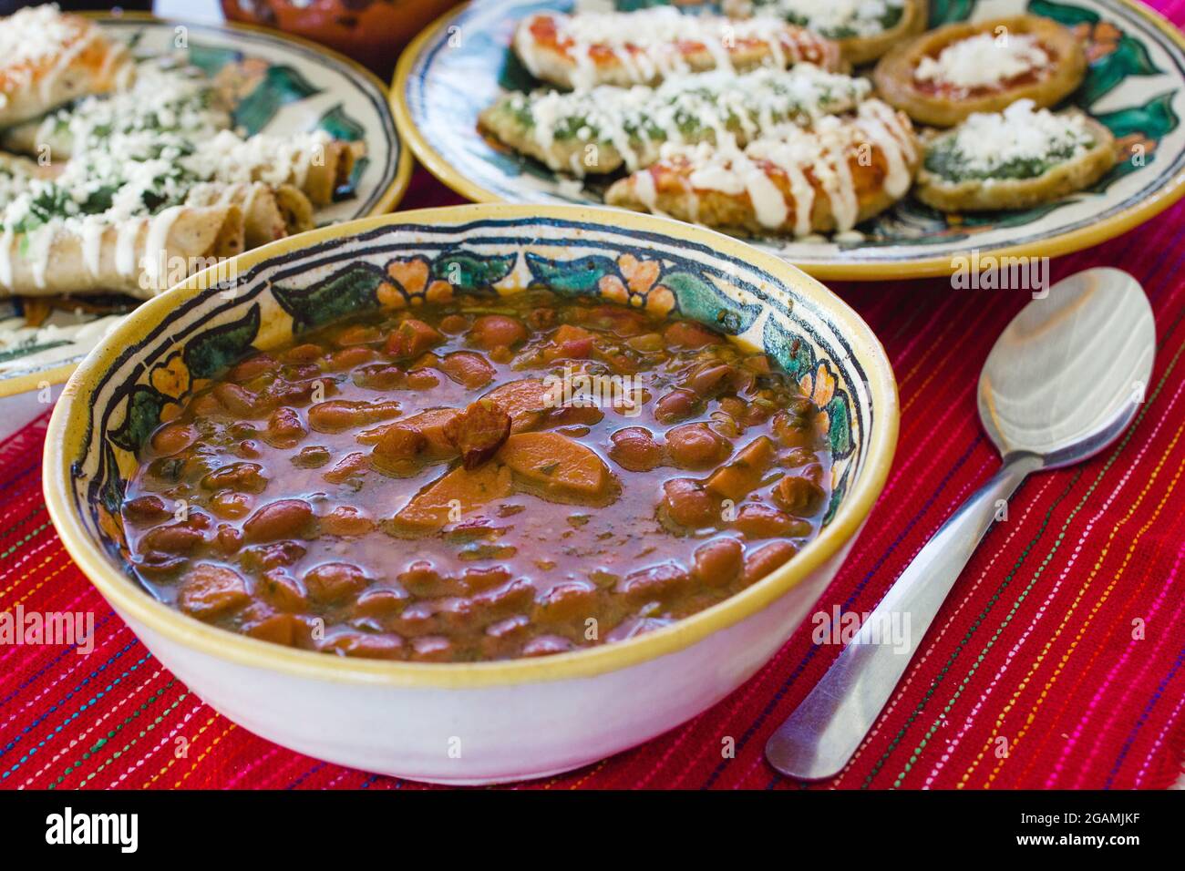 Frijoles charros , tacos dorados and sopes, traditional mexican food in Mexico City Stock Photo