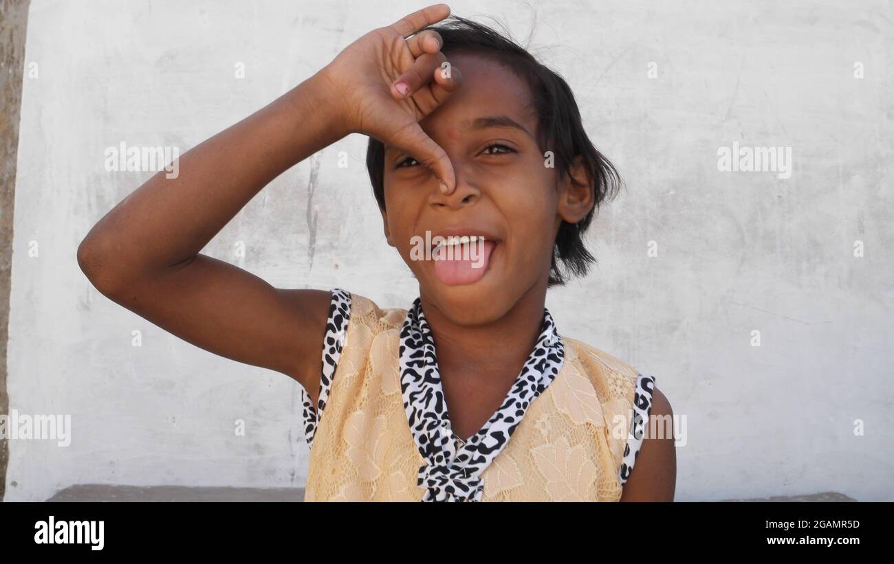 Portrait of an Indian female kid making funny faces Stock Photo - Alamy