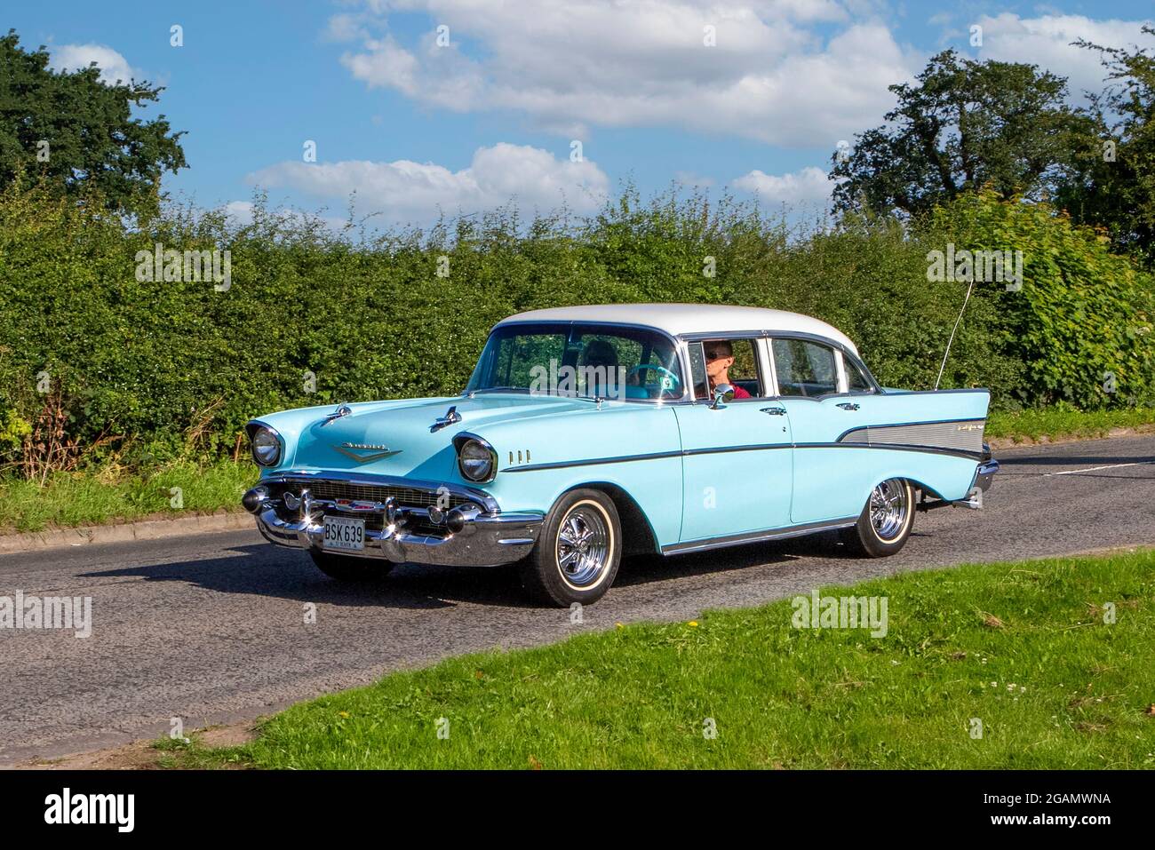 A 1957 50s CHEVROLET GMC BELAIR PETROL classic vintage car arriving at the Capesthorne Hall classic car show. Stock Photo
