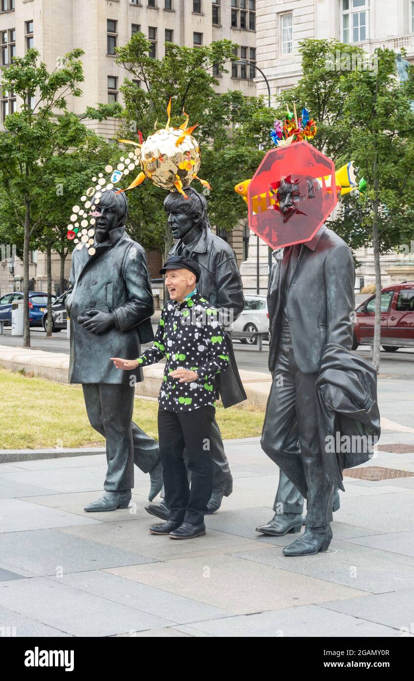 The Beatles statue by Andy Edwards is redressed by artist Stephen Jones at Pier Head in Liverpool Stock Photo