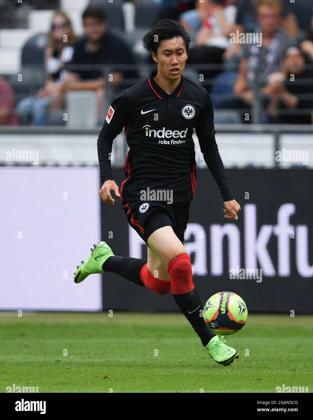 31 July 2021, Hessen, Frankfurt/Main: Football, test matches: Eintracht Frankfurt against AS Saint Étienne at Deutsche Bank Park. Frankfurt's Daichi Kamada in action. Photo: Arne Dedert/dpa Stock Photo