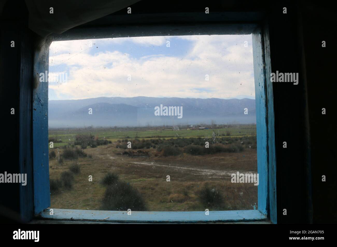 In the spring, from the window of a country house, I saw a view like life! The people of the Turkmen desert are like the view from this window, simple Stock Photo