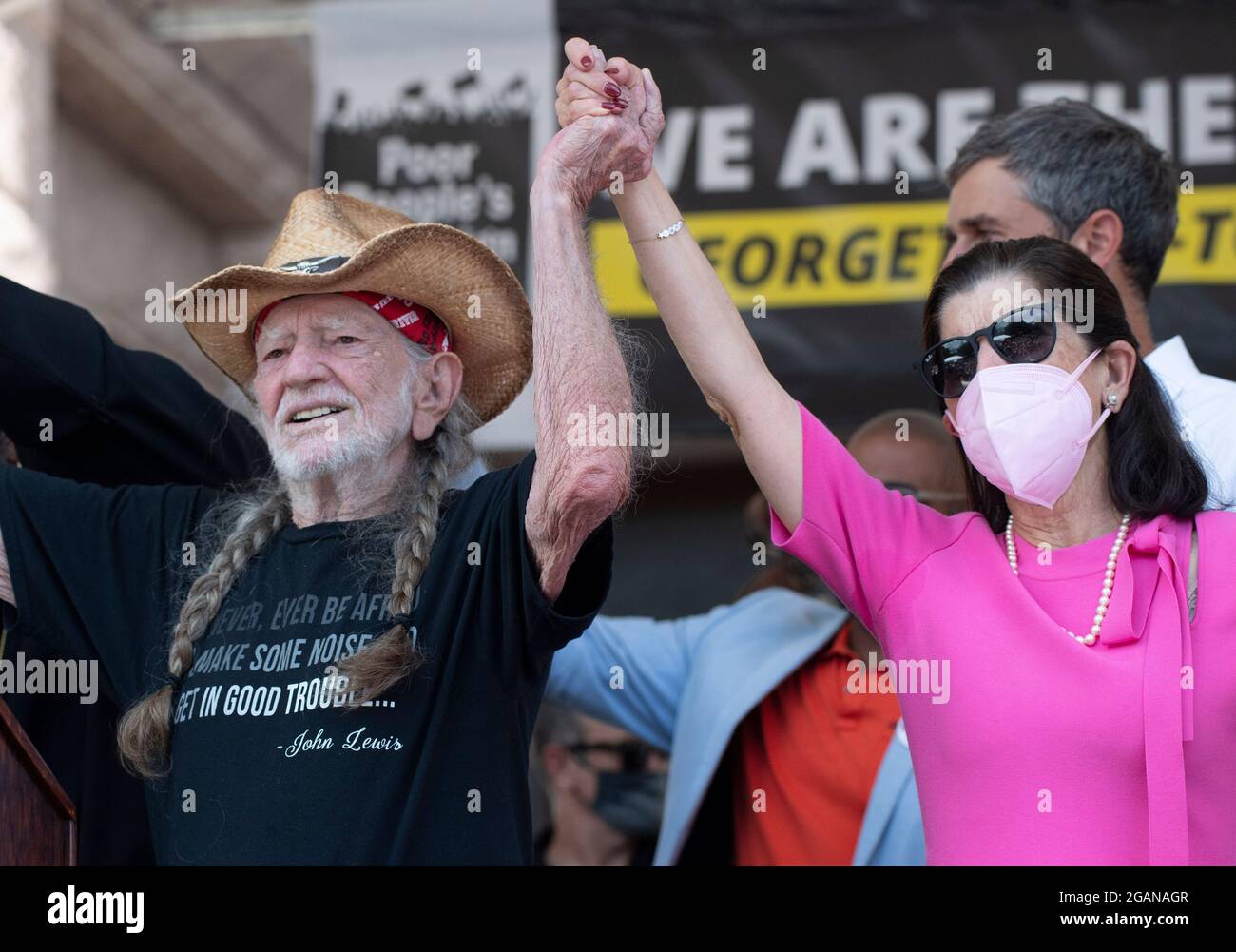 Austin Texas USA, July 31, 2021: Left to right, singer Willie Nelson, former Texas congressman and activist Beto O'Rourke and Luci Johnson, daughter of U.S. Pres. Lyndon Johnson, on stage as voting rights advocates attend a rally at the Texas Capitol, where dozens of speakers criticized Republican efforts to alter voting procedures nationwide and in Texas. About 3,000 people were treated to a 3-song set by Nelson and his band. Credit: Bob Daemmrich/Alamy Live News Stock Photo