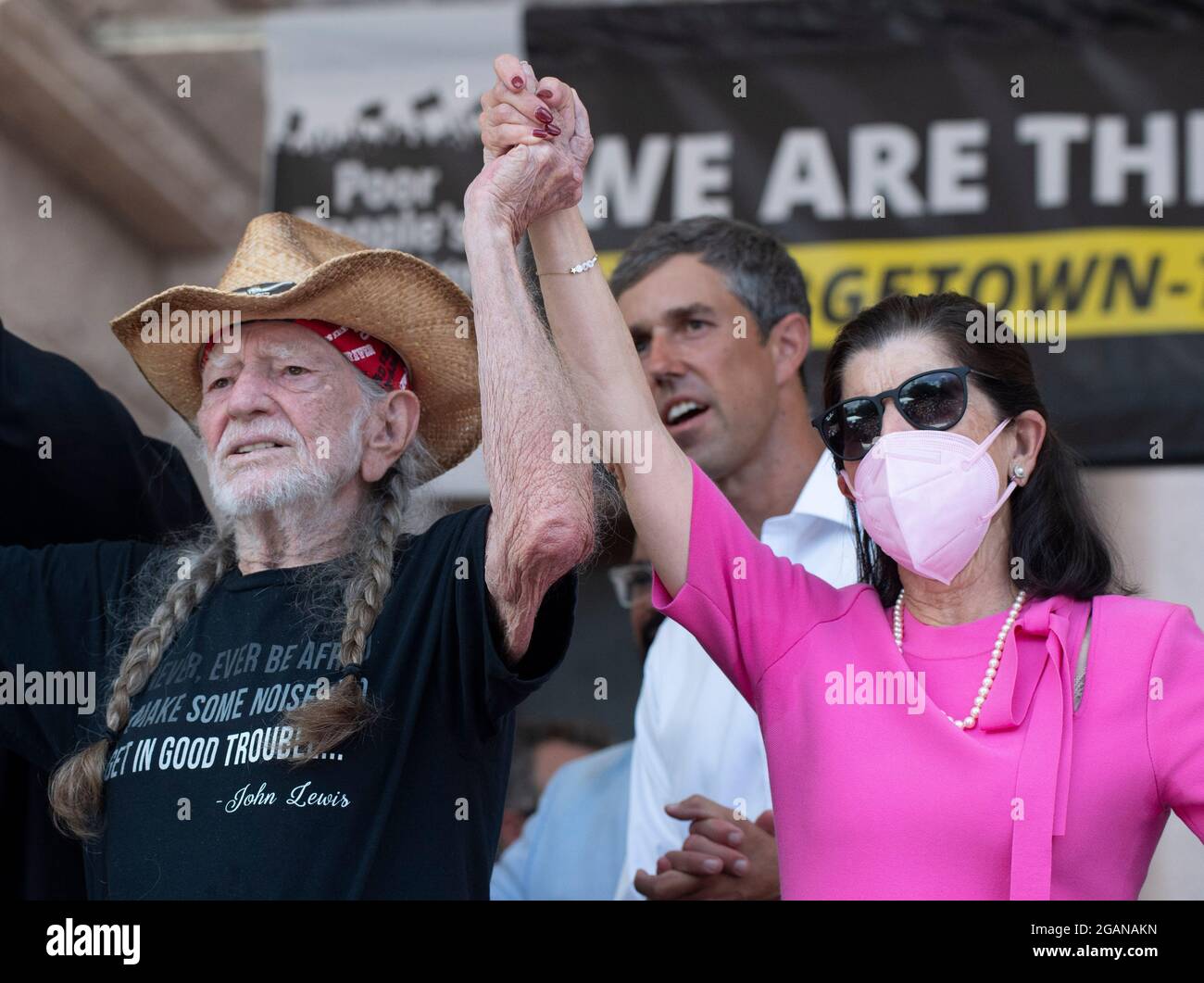 Austin Texas USA, July 31, 2021: Left to right, singer Willie Nelson, former Texas congressman and activist Beto O'Rourke and Luci Johnson, daughter of U.S. Pres. Lyndon Johnson, on stage as voting rights advocates attend a rally at the Texas Capitol, where dozens of speakers criticized Republican efforts to alter voting procedures nationwide and in Texas. About 3,000 people were treated to a 3-song set by Nelson and his band. Credit: Bob Daemmrich/Alamy Live News Stock Photo