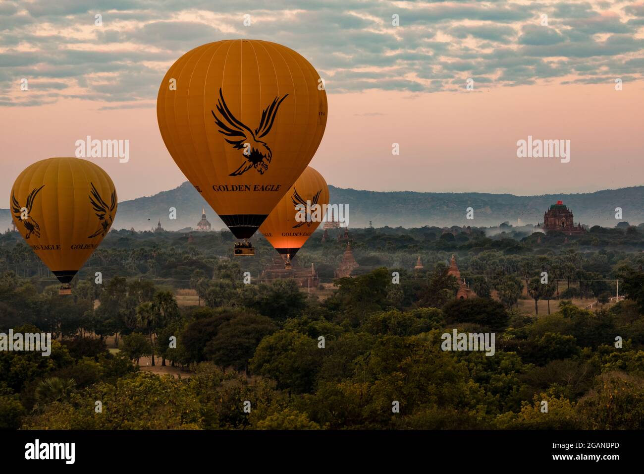 Pre-sunrise balloons over the temples of the Bagan World Heritage Site in Myanmar Stock Photo