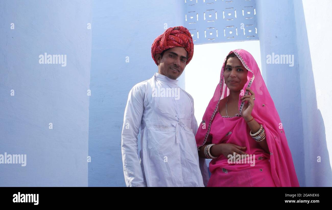 Indian couple in Indian traditional clothing posing Stock Photo - Alamy
