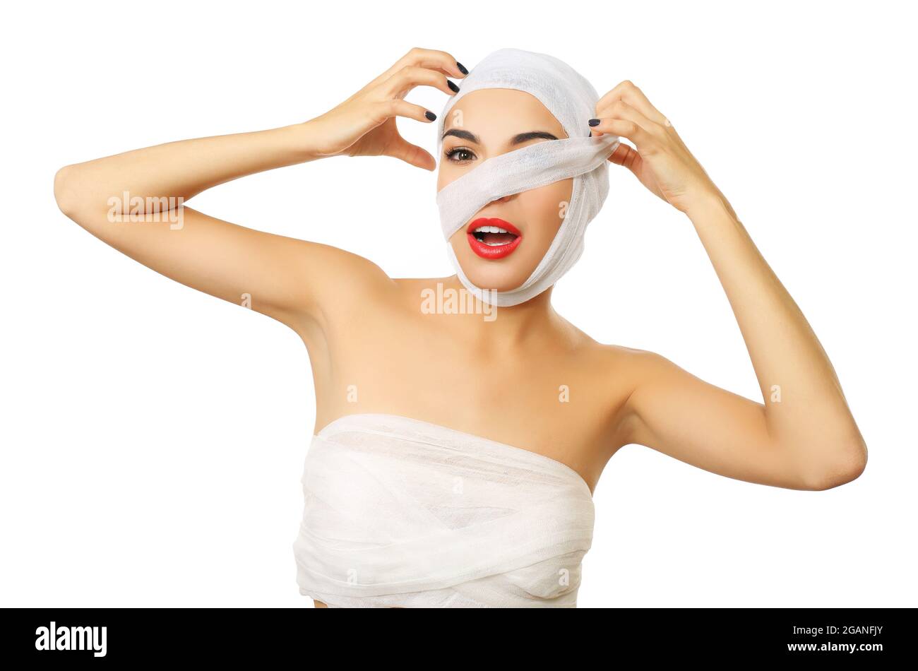 Young beautiful woman with a gauze bandage on her head, eye and nose