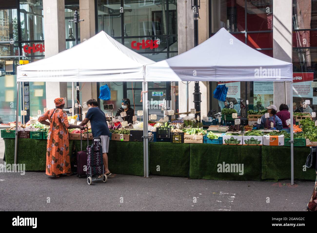 Croydon surrey street market vendors selling fruits and vegetables in open air market Stock