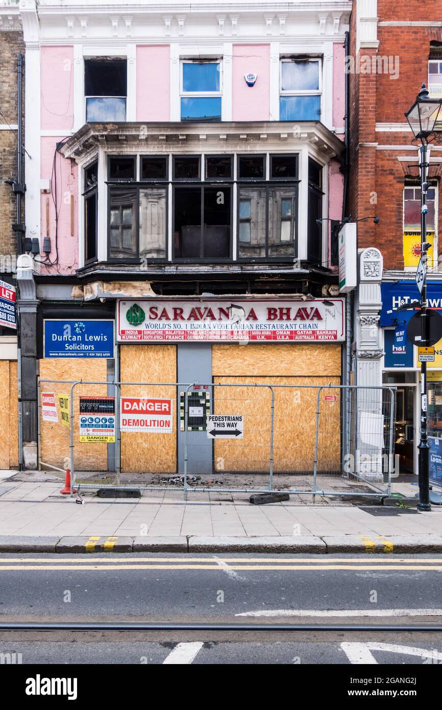 Fire accident destroyed Croydon Indian restaurant Saravan Bhavan and Solicitor office in the first floor of the building Stock Photo