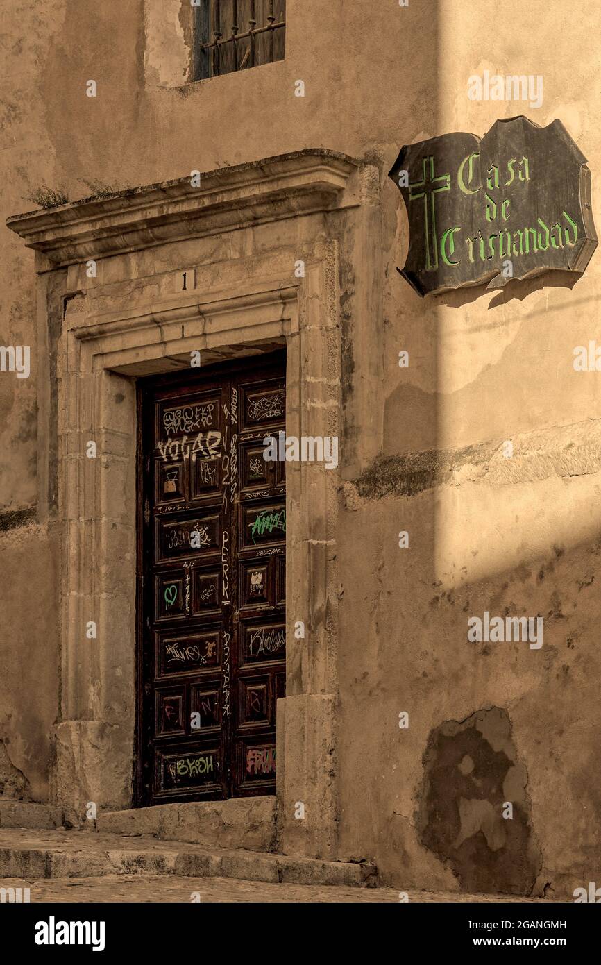 Entrance door all painted on the main facade of Casa La Cristiandad in the city of Cuenca, Spanish community of Castilla la Mancha, Spain Stock Photo