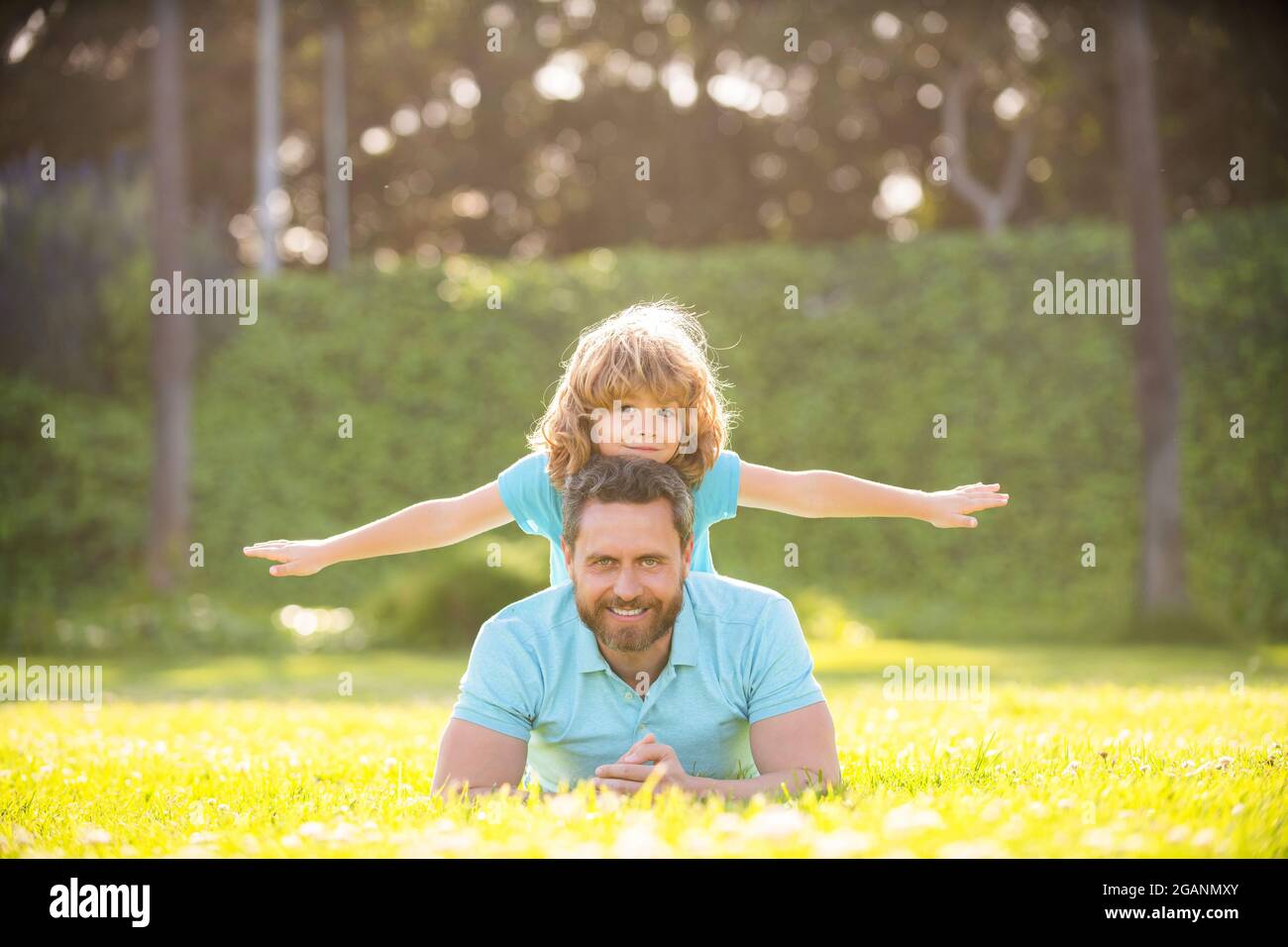fathers day. cheerful father and son having fun in park. family value. childhood and parenthood Stock Photo